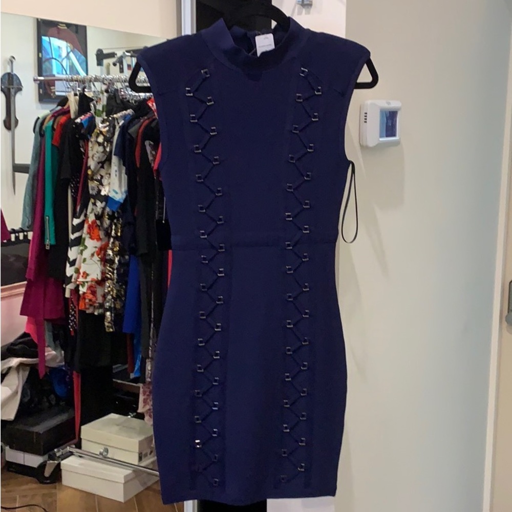 Navy blue, mini length. Gunmetal details. Mock neck, padded shoulders.